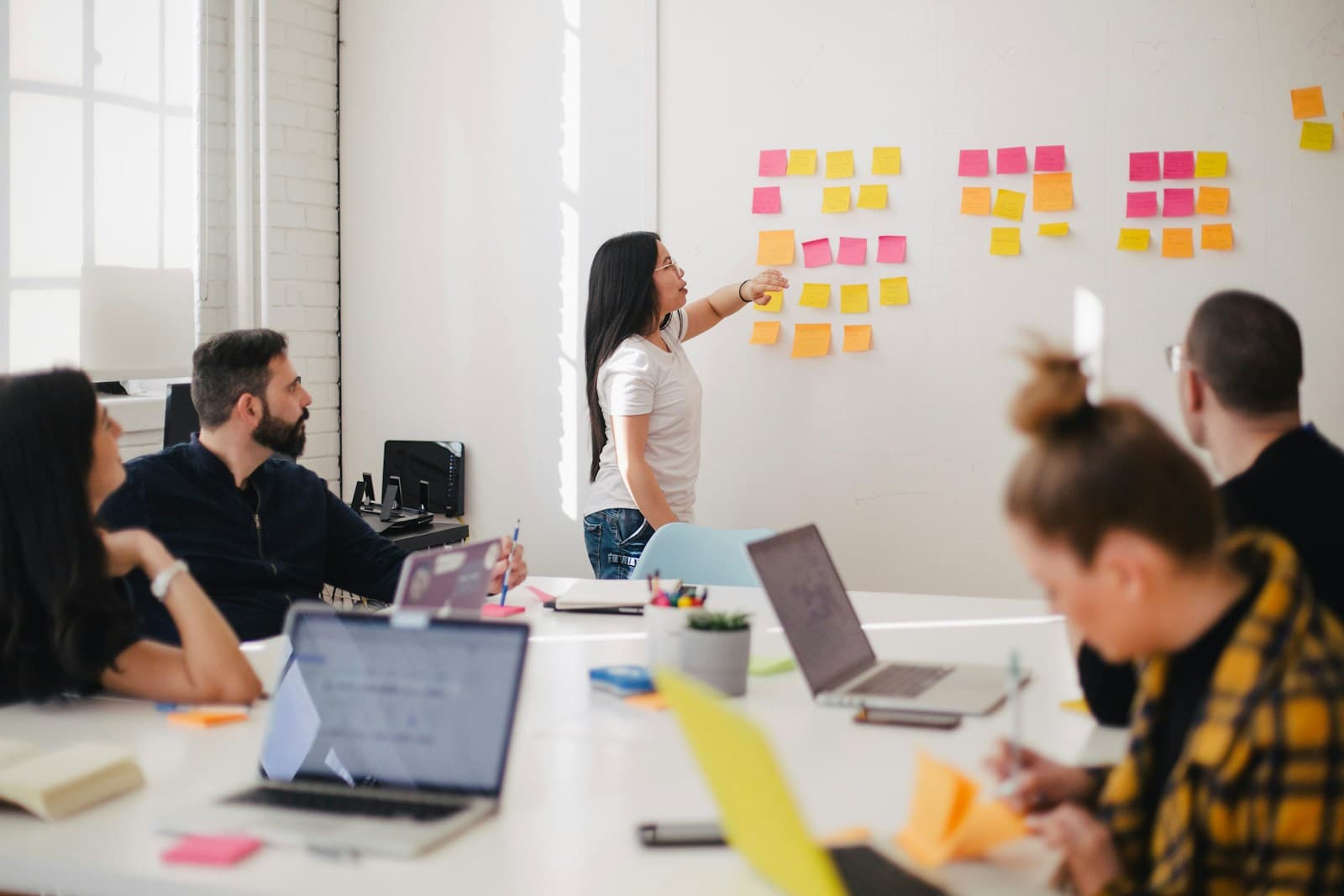 Team collaborating around a whiteboard in an office