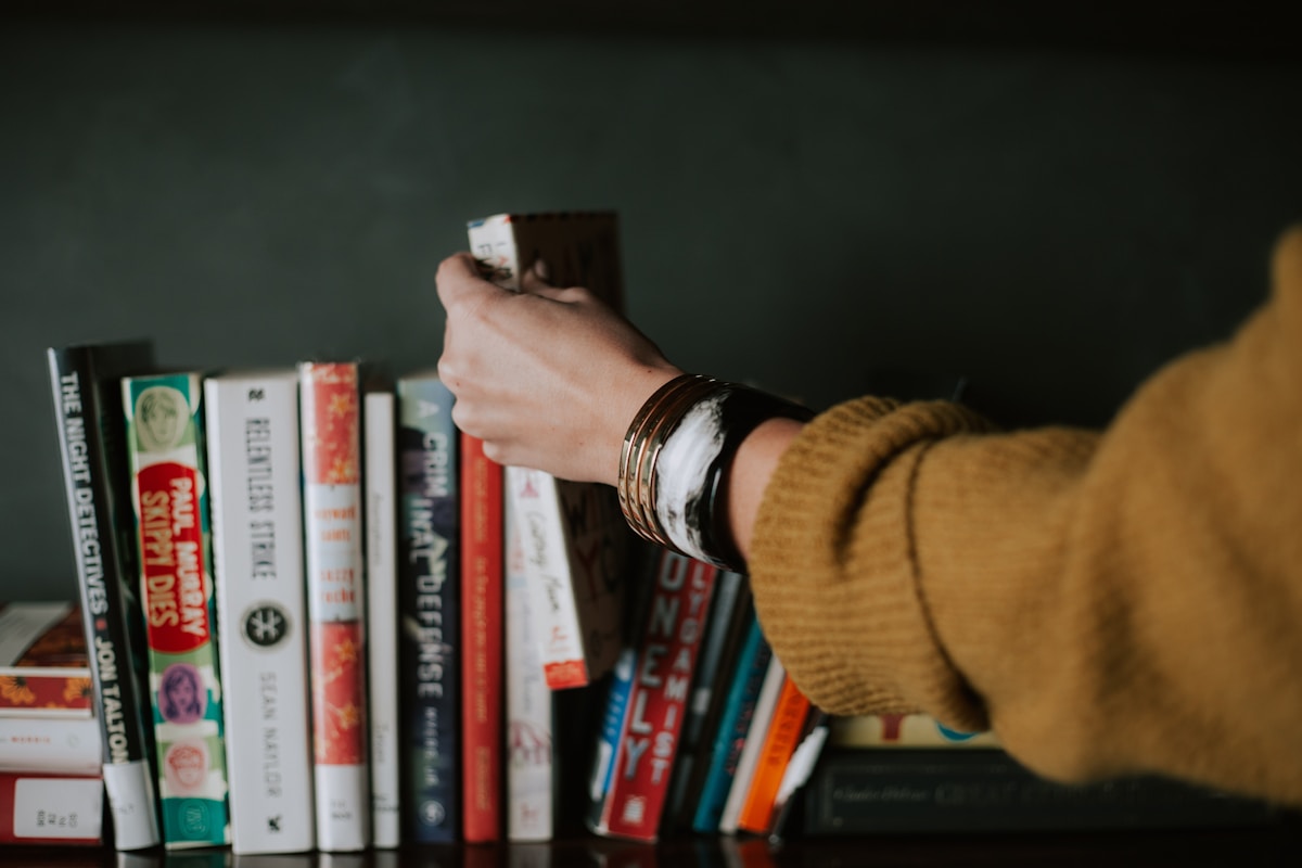 Person holding an open book