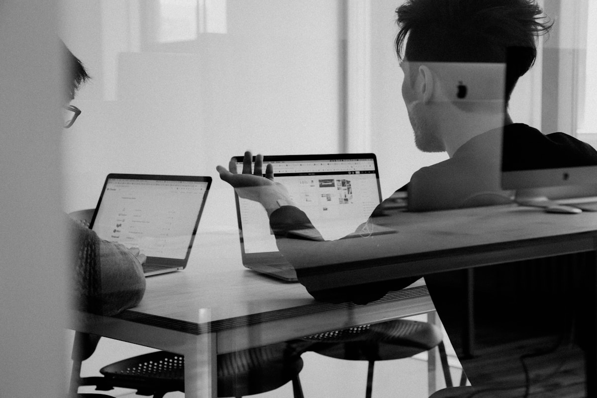 Team collaborating around a whiteboard in an office